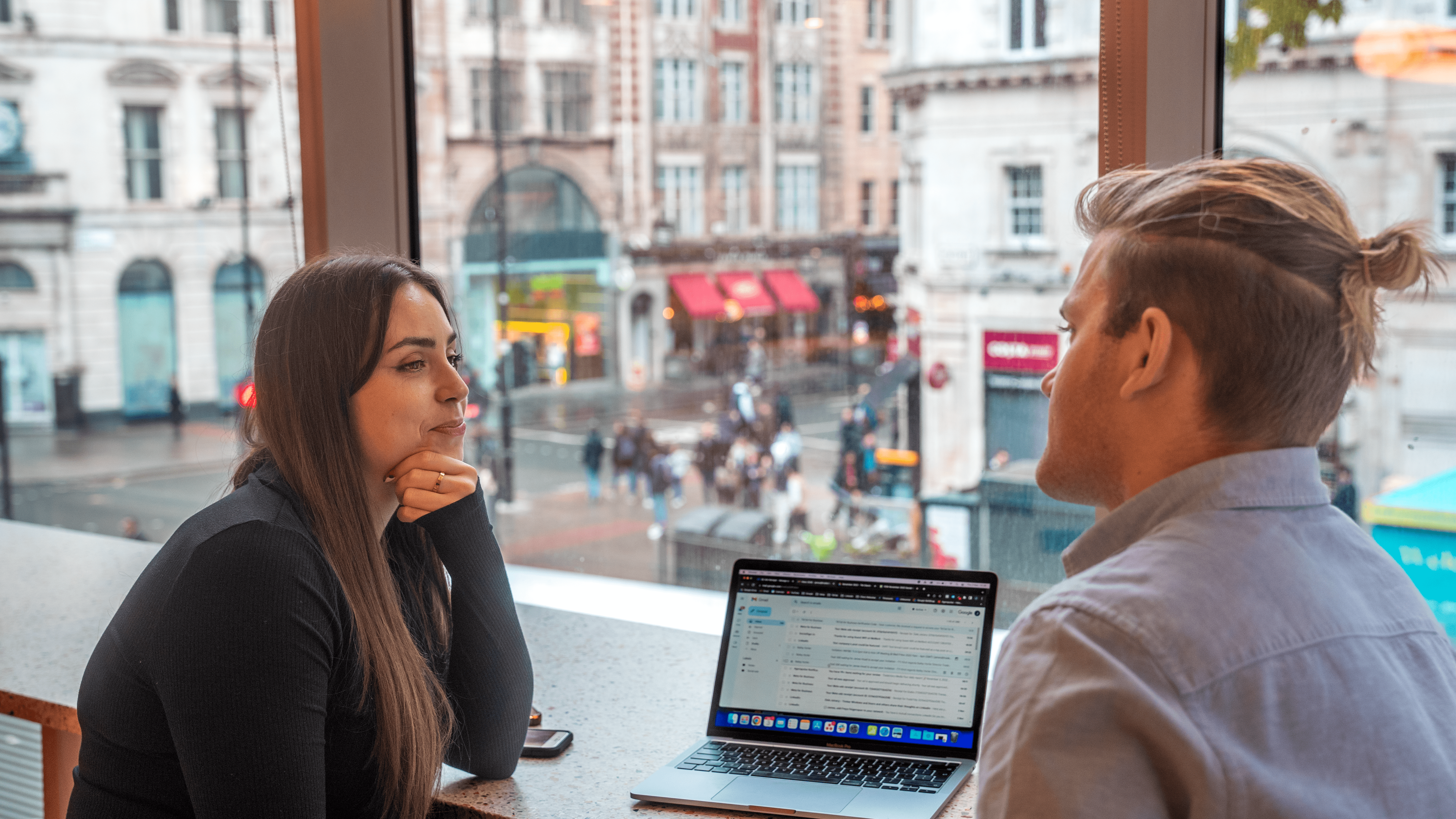 Tradectory Team Meeting in London sitting at laptop with street in background